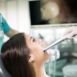 Dental patient looking at intraoral images