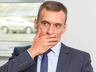 Man covering his mouth